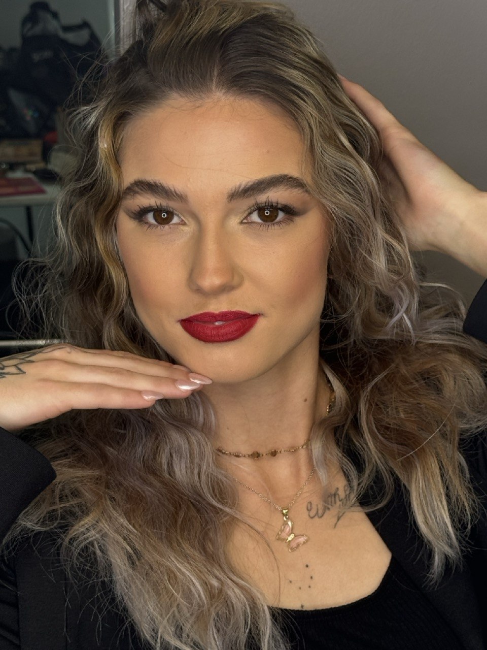 Signature glam close-up, deep red lip, dimensional eye
